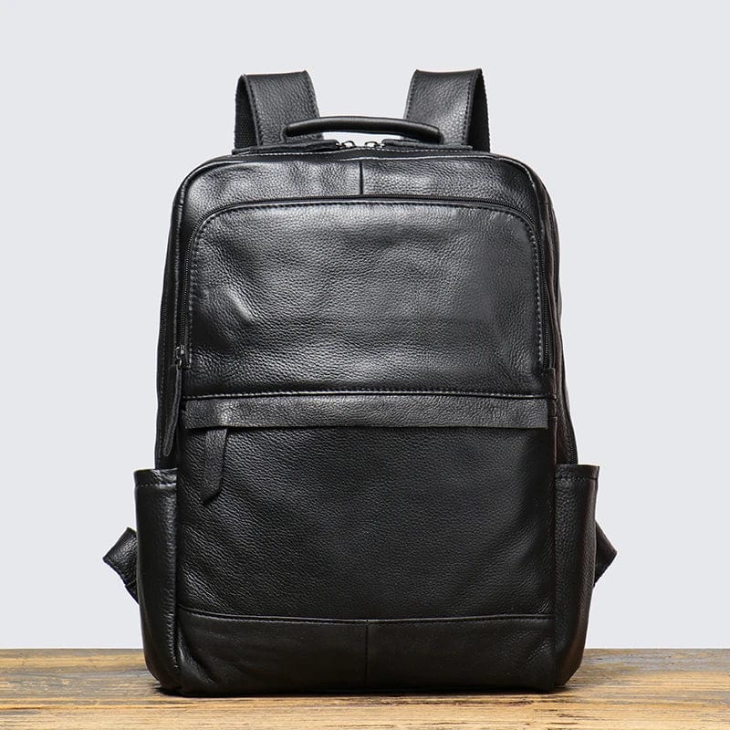 Sac à dos en cuir noir pour transporter un ordinateur portable 15 pouces, idéal pour les hommes d'affaires