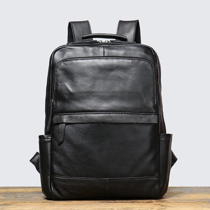 Sac à dos en cuir noir pour transporter un ordinateur portable 15 pouces, idéal pour les hommes d'affaires
