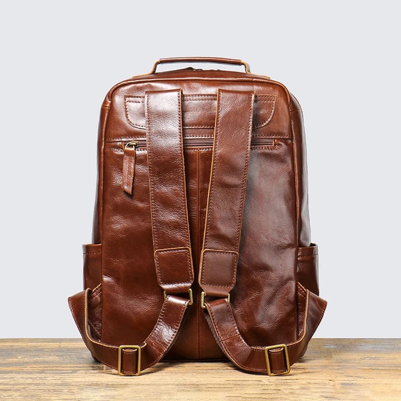 Vue latérale du sac à dos en cuir 15 pouces, spacieux pour les affaires et l'ordinateur, pour homme