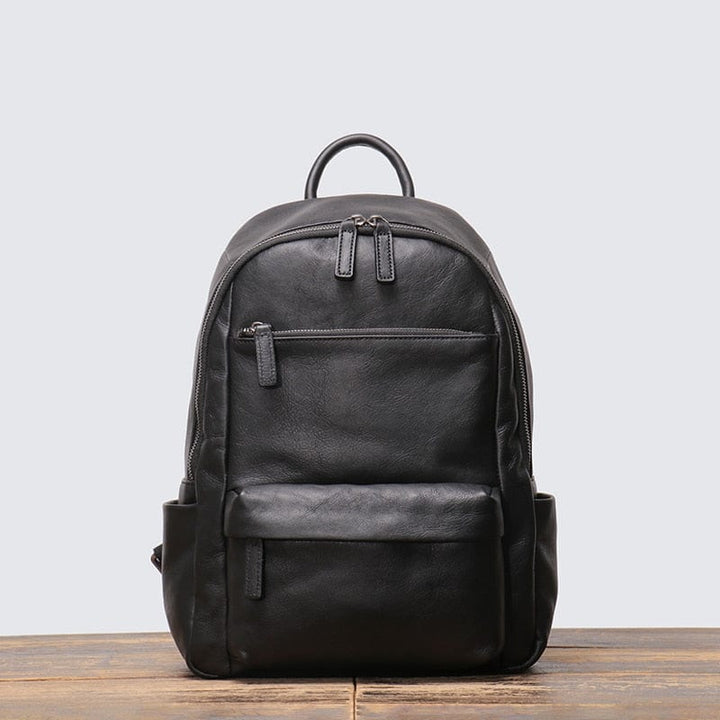 Sac à dos en cuir pour homme, de couleur noire, avec multiples compartiments de rangement pratique