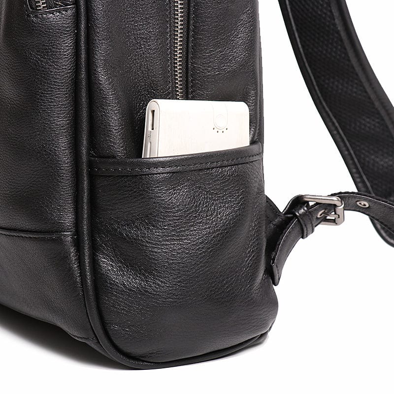 Sac à dos cuir véritable, noir, pour homme, offrant un look moderne et sophistiqué pour tout déplacement.