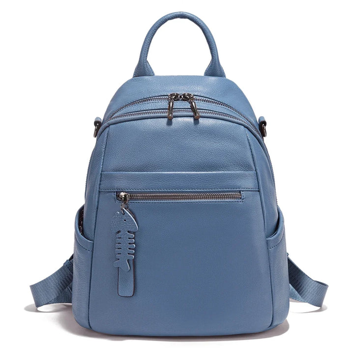 Sac à dos en cuir pour femme, bretelles ajustables, style épuré et grande capacité.