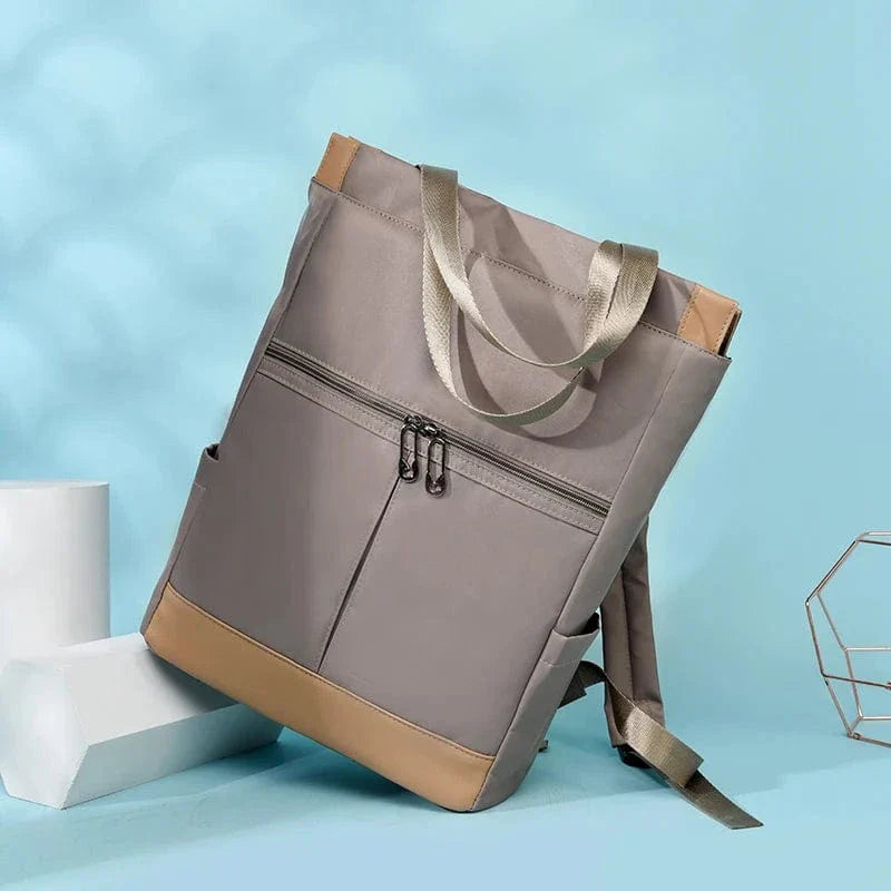 Sac à dos stylé en nylon Oxford bleu pour femme, imperméable, avec des bretelles ajustables pour le confort.