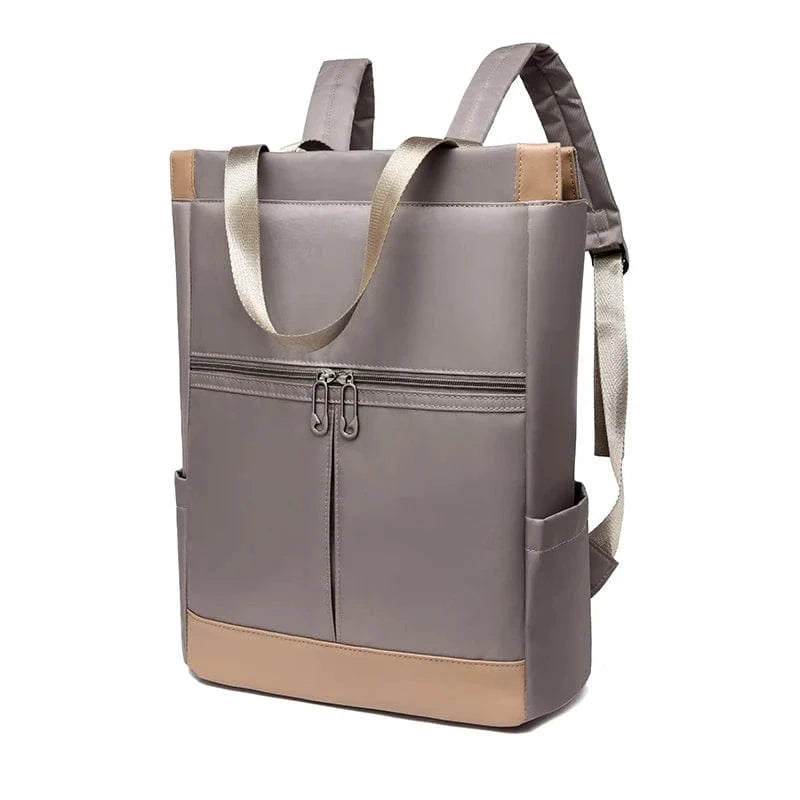Sac à dos portable femme en nylon Oxford bleu, étanche, parfait pour un style de vie actif et organisé.
