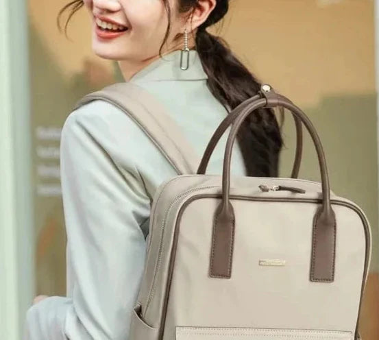 Sac à dos professionnel femme, couleur noir, avec bretelles ajustables pour ordinateur portable 15 pouces.