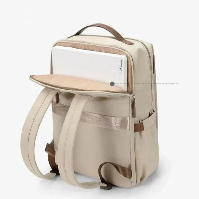 Sac à dos ordinateur femme avec port de chargement USB intégré, couleur gris, pratique pour le voyage.