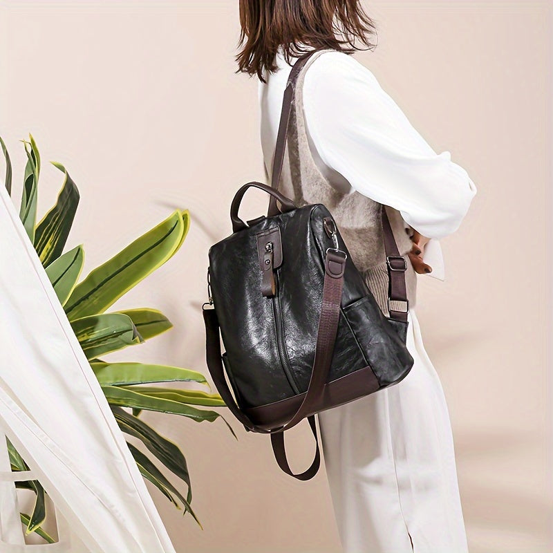 Sac à dos antivol en cuir PU pour femme, design moderne et sûr, parfait pour la ville.