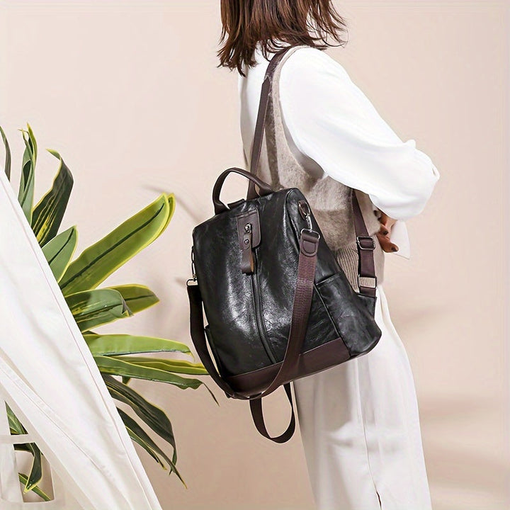 Sac à dos antivol en cuir PU pour femme, design moderne et sûr, parfait pour la ville.