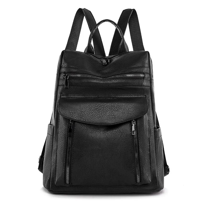 Gros plan sur la fermeture éclair dorée du sac à dos en cuir vegan, détail élégant et sécurisé.