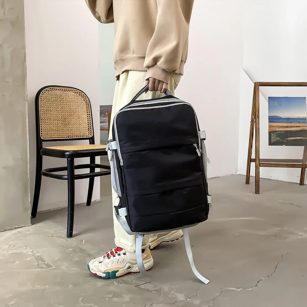 Sac à dos de voyage femme rouge vif avec poignée supérieure renforcée, bagage à main pratique