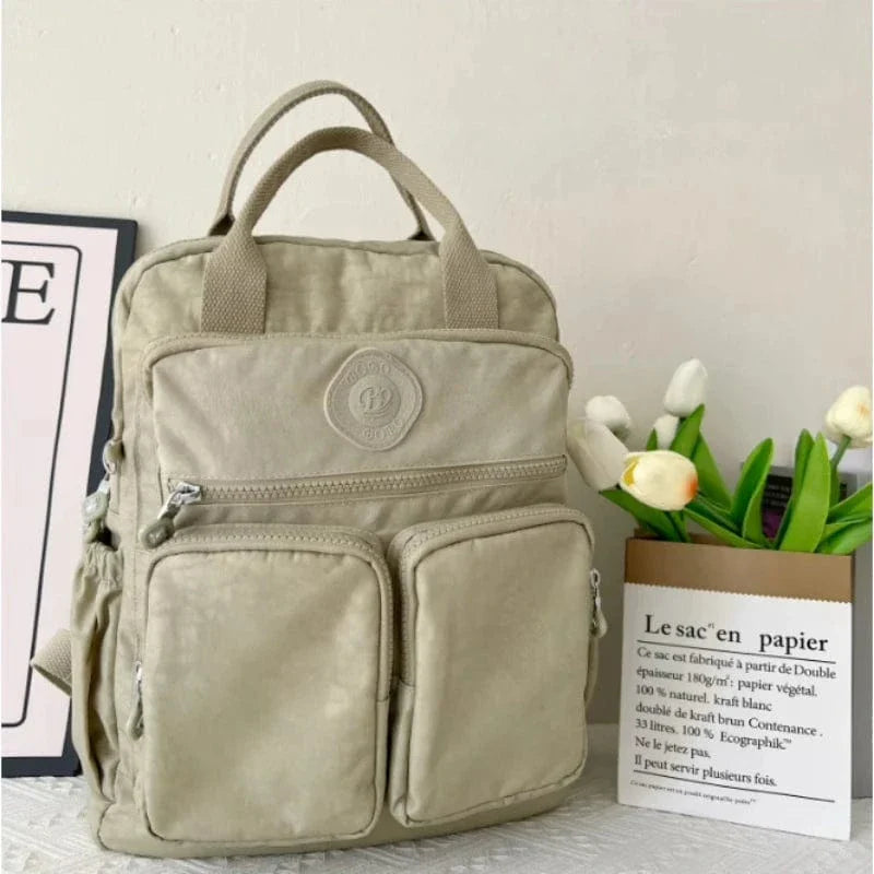 Sac à dos femme moderne, allie style et fonctionnalité pour le collège, l'école, l'ordinateur 14 pouces et le voyage.