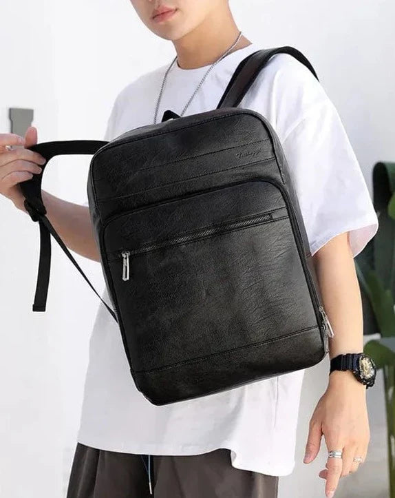 Sac à dos de luxe en cuir PU noir pour homme, imperméable, alliant style et fonctionnalité pour laptop.