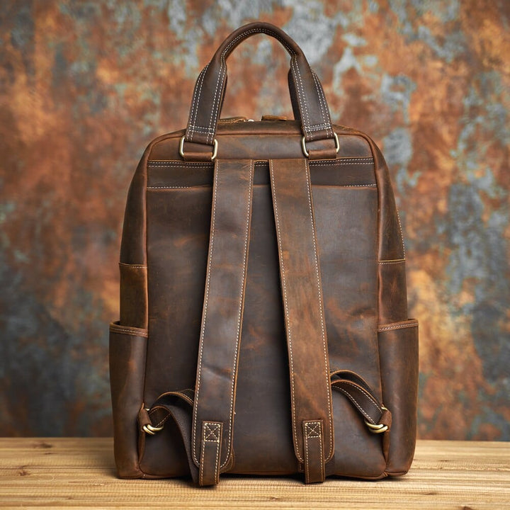 Sac à dos homme en cuir brun café, idéal pour voyage, avec sangles réglables et multiples poches