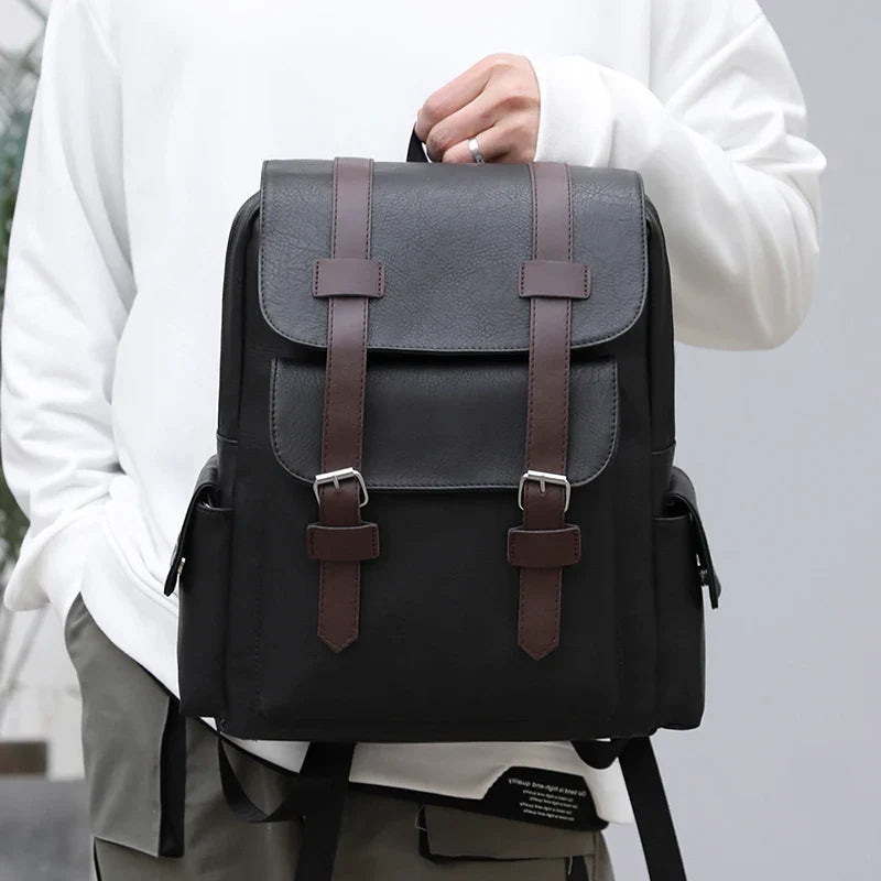 Sac à dos de travail noir en similicuir, conçu pour l'homme moderne et le style urbain.
