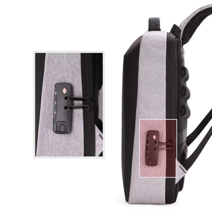 Sac à dos gris homme anti-vol avec coque rigide, idéal pour transporter votre PC portable en voyage ou au bureau.