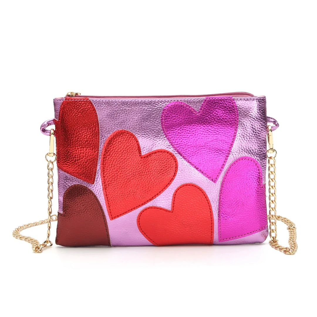 Sac similicuir femme, effet métallisé scintillant, orné de cœurs délicats. Très chic et élégant.