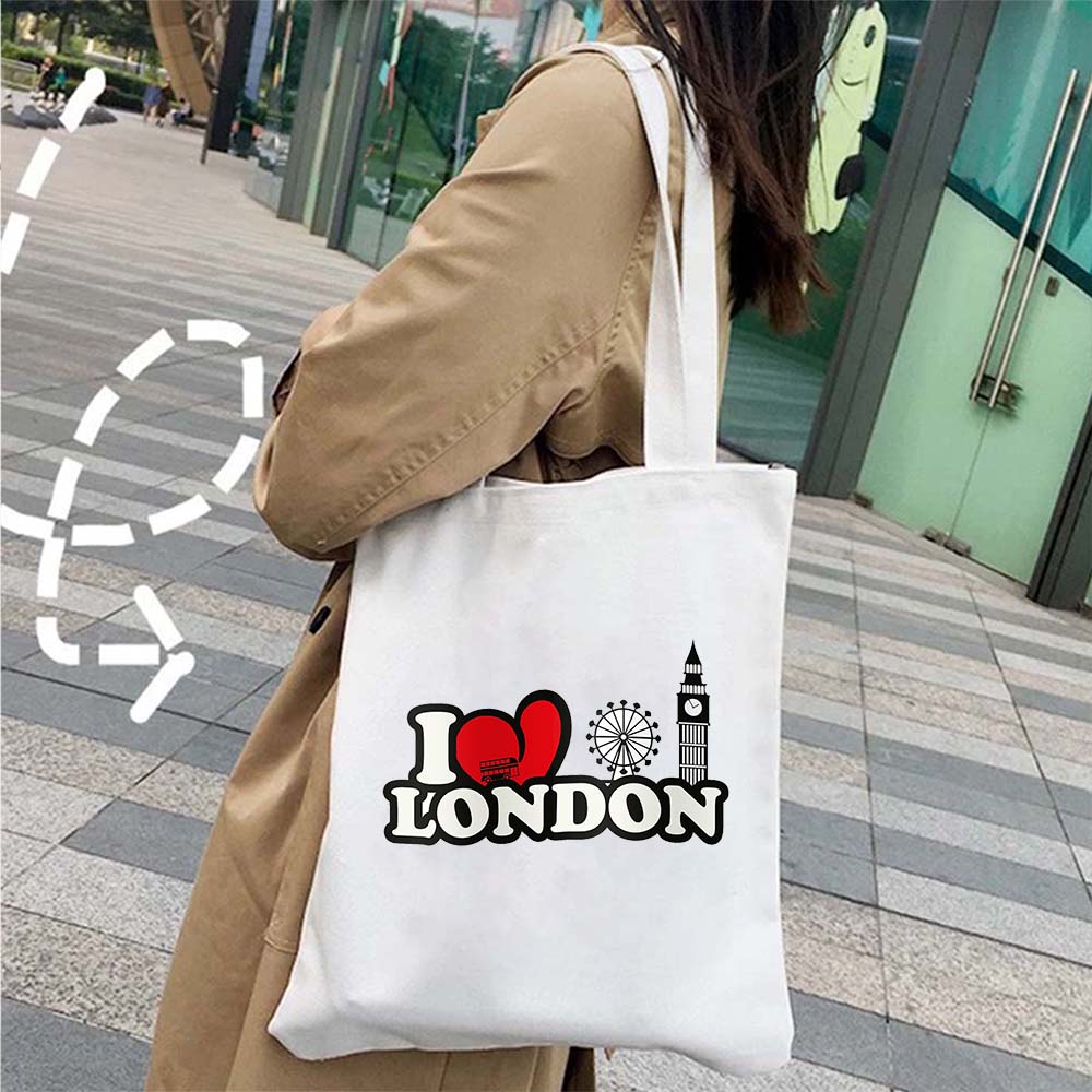 Sac cabas en coton imprimé emblèmes de Londres, un accessoire indispensable et stylé.