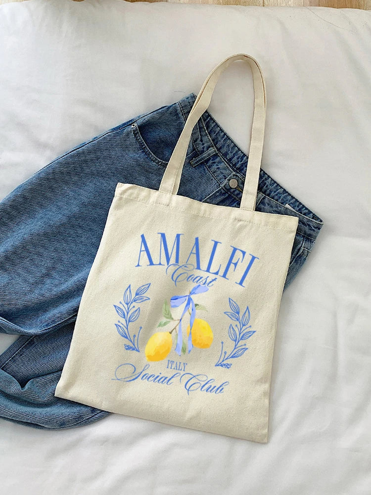 Élégant tote bag en toile, motif méditerranéen, idéal pour le shopping ou un voyage printanier.
