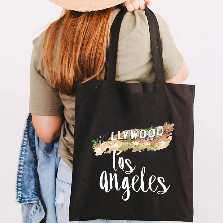Sac Los Angeles noir en coton, parfait pour voyage, avec ances robustes; un accessoire mode et écologique.