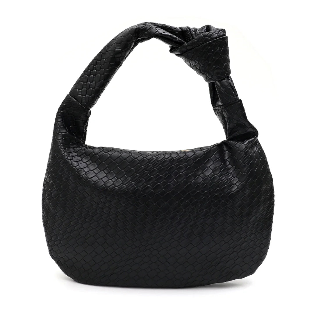 Accessoire mode: sac hobo femme moderne en similicuir, souple et élégant pour look chic.