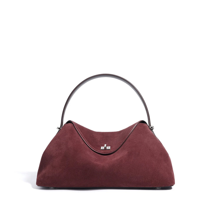 Texture douce du cuir suédé marron sur sac à main Alma, sac élégant pour femme