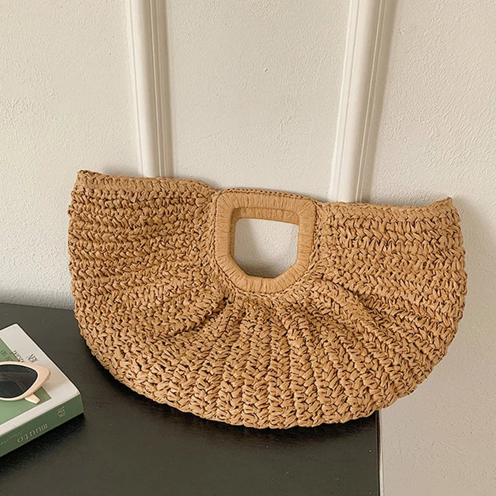 Sac de plage Anja pour femme, en paille naturelle, grand espace de rangement, style bohème élégant.