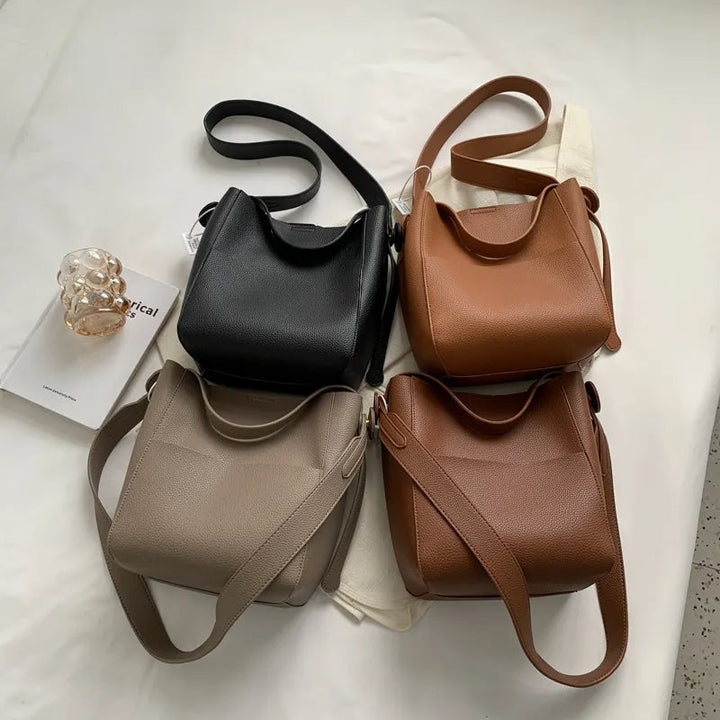 Sac femme en cuir synthétique, style seau, polyvalent et spacieux, idéal pour le travail ou les sorties.