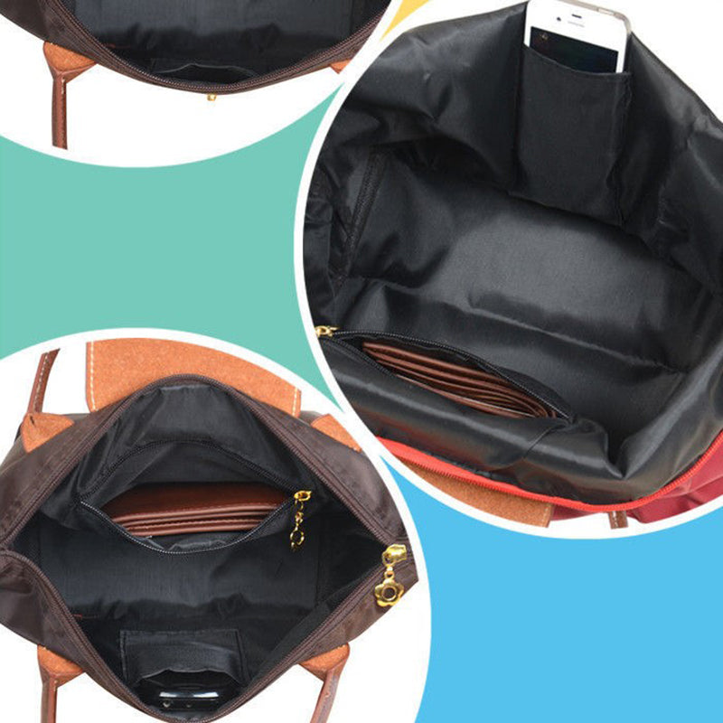 Sac à main de luxe bleu marine pour femme, chic et spacieux, avec anses confortables.