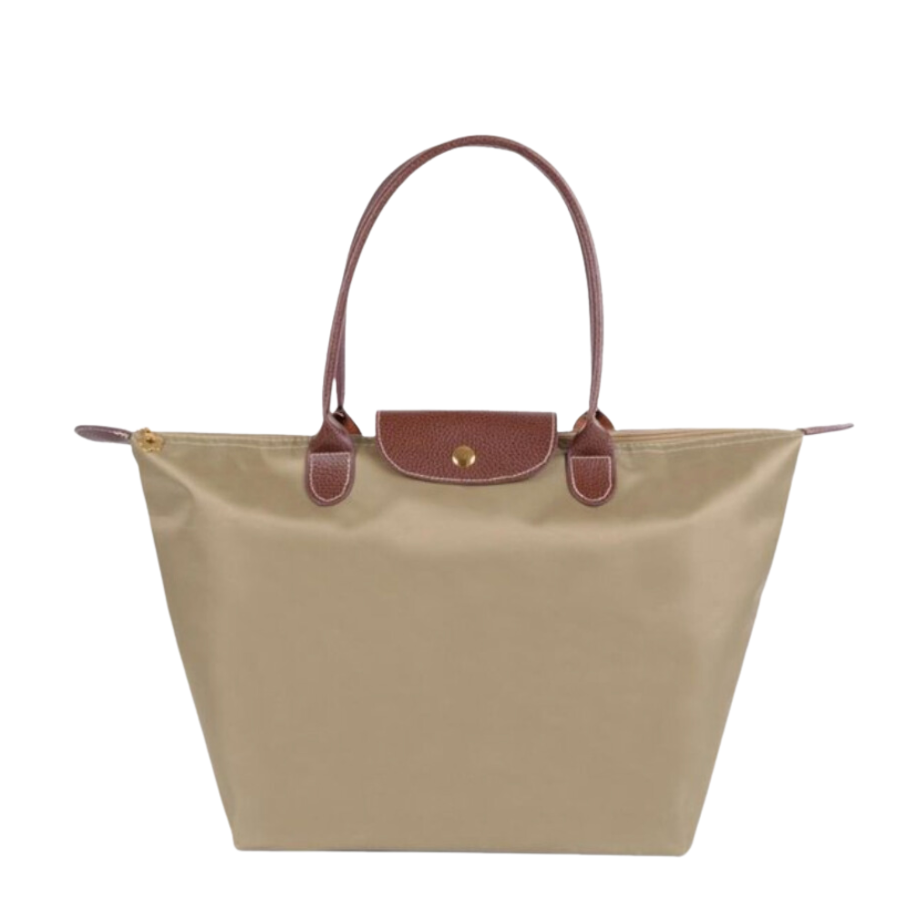 Sac à main de luxe spacieux avec anses robustes, accessoire chic pour femme moderne.