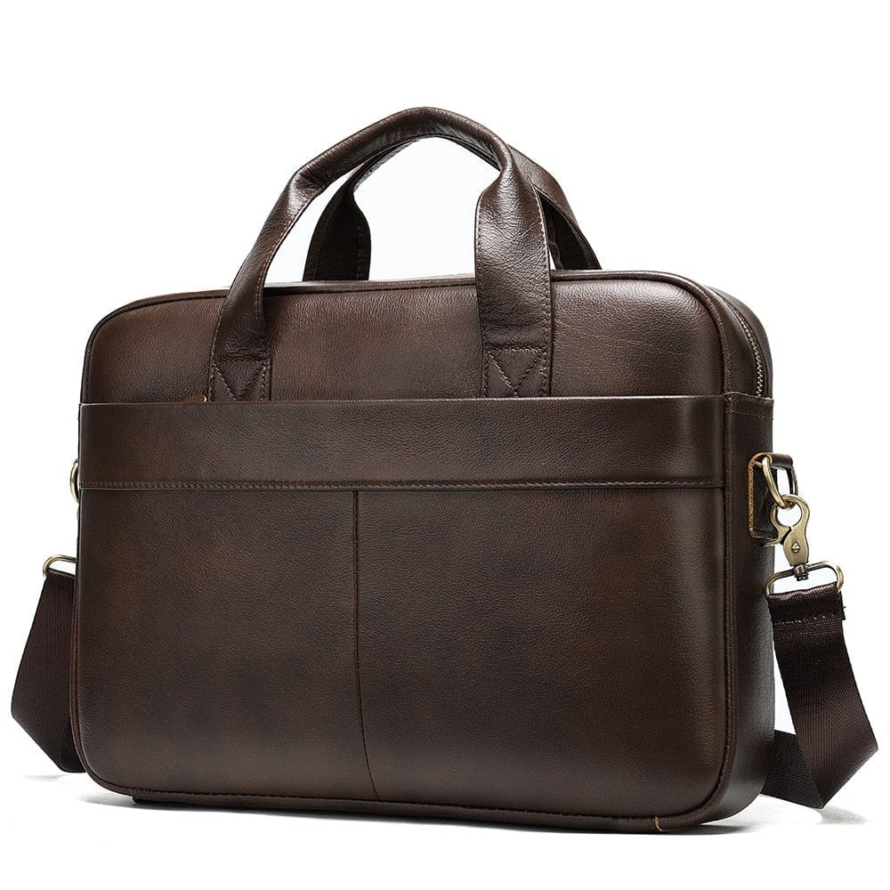Sac pour ordinateur portable, porté épaule par un homme en costume, style professionnel