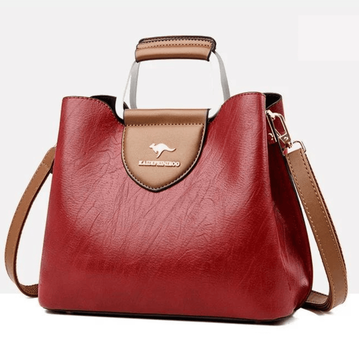 Sac à main en cuir pour femme avec poignée robuste et bandoulière, accessoire polyvalent.