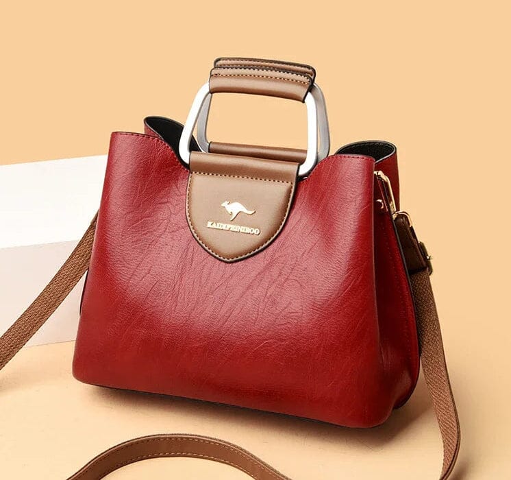 Sac à main en cuir femme porté épaule, style intemporel, parfait pour un look quotidien.