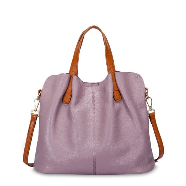 Sac bandoulière femme en cuir bicolore, design original et élégant, accessoire mode chic et intemporel.