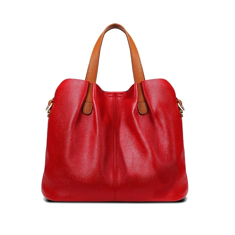 Sac à main tendance femme en cuir, design bicolore original, avec bandoulière ajustable, accessoire durable.