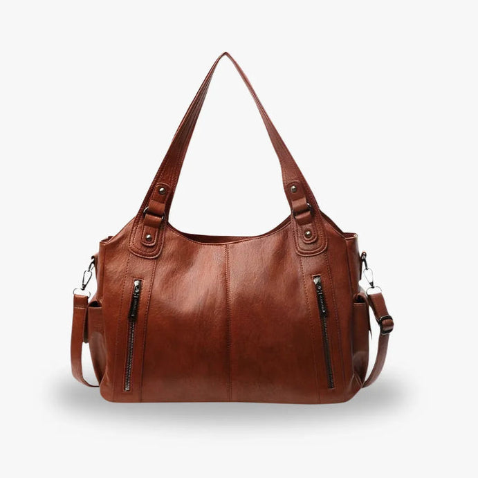 Sac femme Aliona couleur chocolat porté main, accessoire tendance et polyvalent.