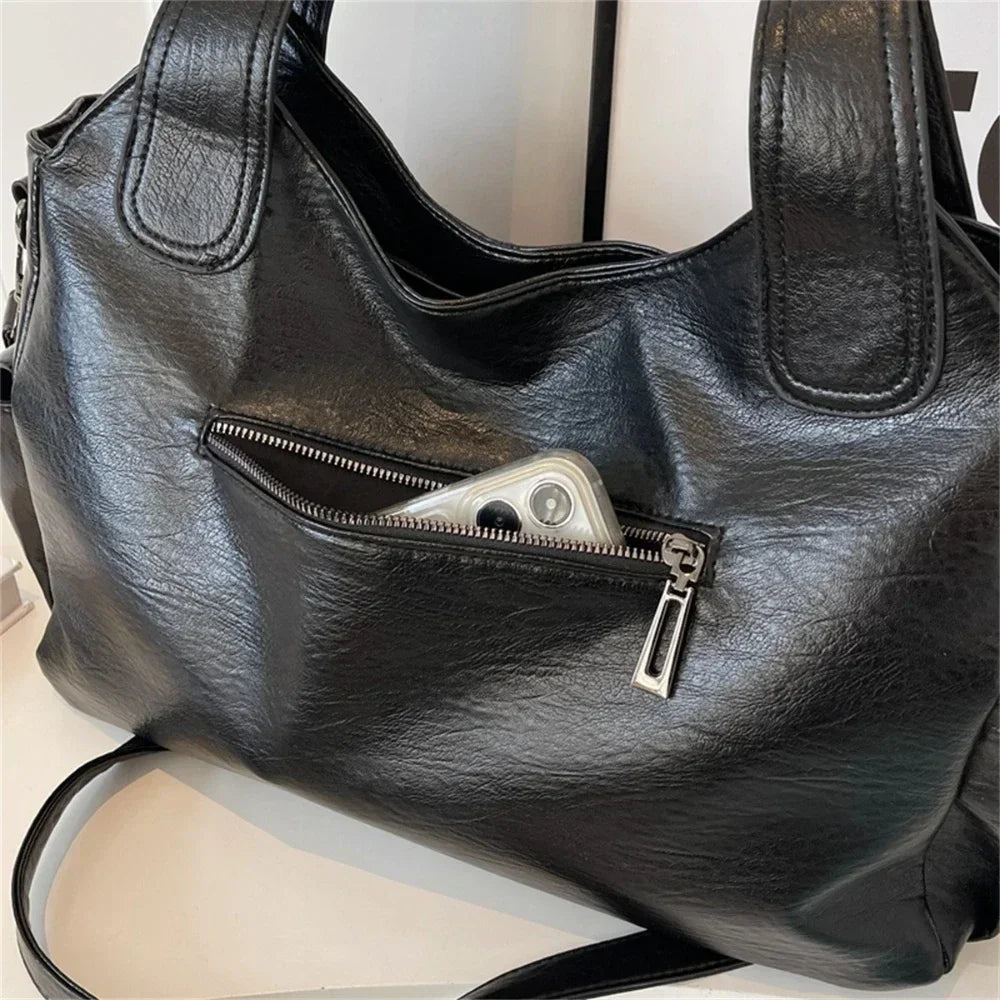 Sac à main élégant Aliona, parfait pour le travail ou les sorties, bandoulière incluse.