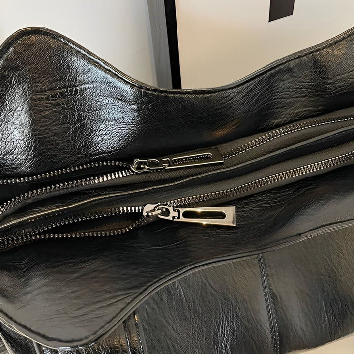 Sac Aliona pratique avec fermeture sécurisée, design moderne pour femme active.
