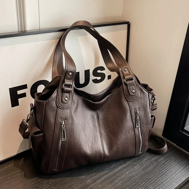 Sac Aliona noir polyvalent, avec organisation intérieure optimisée pour le quotidien.
