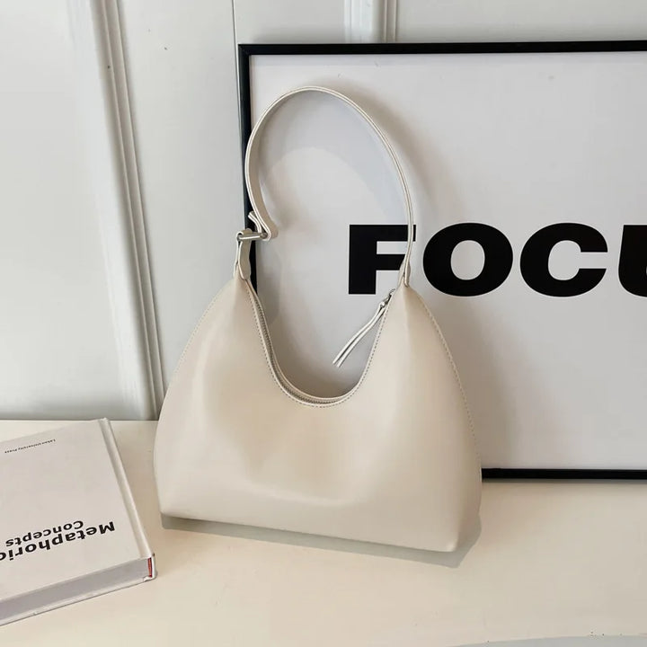 Sac à main Anola, élégant et tendance, petit format pour femme, idéal porté épaule en polyuréthane.