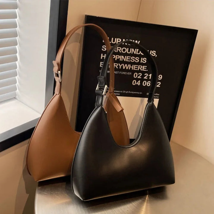 Sac à main femme élégant Anola, design hobo en polyuréthane, style compact et moderne.