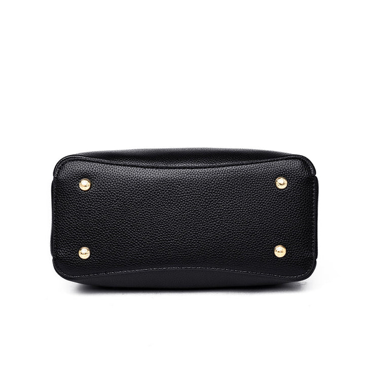 Sac à main noir spacieux et élégant pour femme, en cuir synthétique, un classique intemporel.