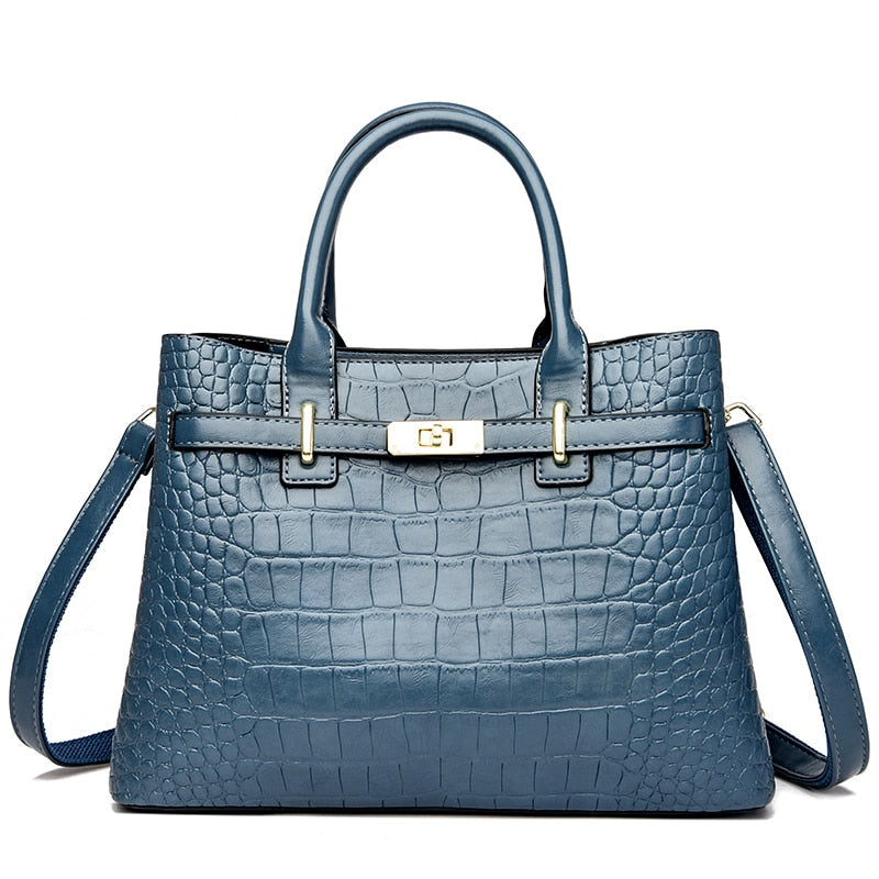 Sac à main rouge bordeaux effet croco pour femme. Un accessoire mode chic et structuré en cuir synthétique.