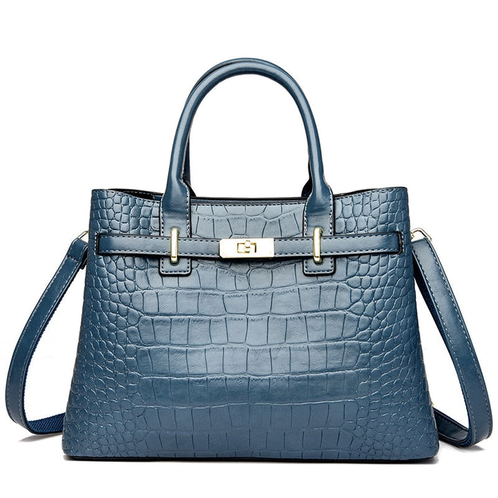 Sac à main rouge bordeaux effet croco pour femme. Un accessoire mode chic et structuré en cuir synthétique.