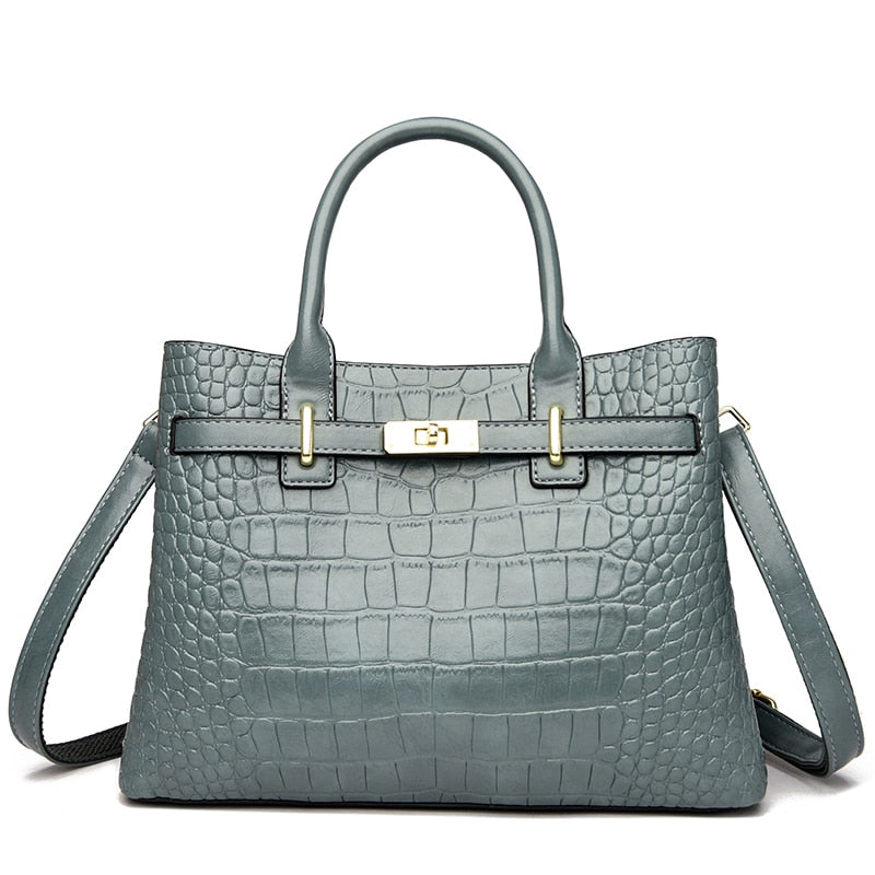 Sac à main noir structuré effet croco, avec anse élégante. Accessoire mode chic en cuir synthétique femme.