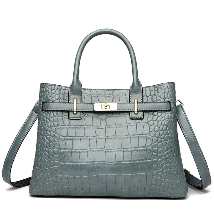 Sac à main noir structuré effet croco, avec anse élégante. Accessoire mode chic en cuir synthétique femme.