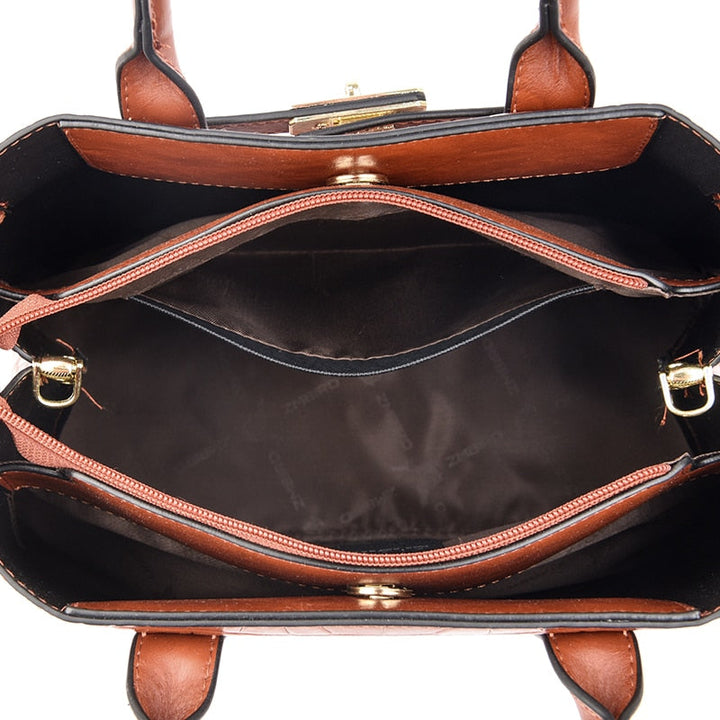 Gros plan sur la texture effet croco d'un sac à main femme noir, accessoire chic en cuir synthétique.