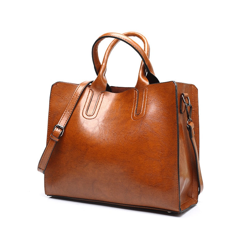 Sac à main femme en cuir marron élégant avec bandoulière, parfait pour le quotidien. Mode et accessoire intemporel.