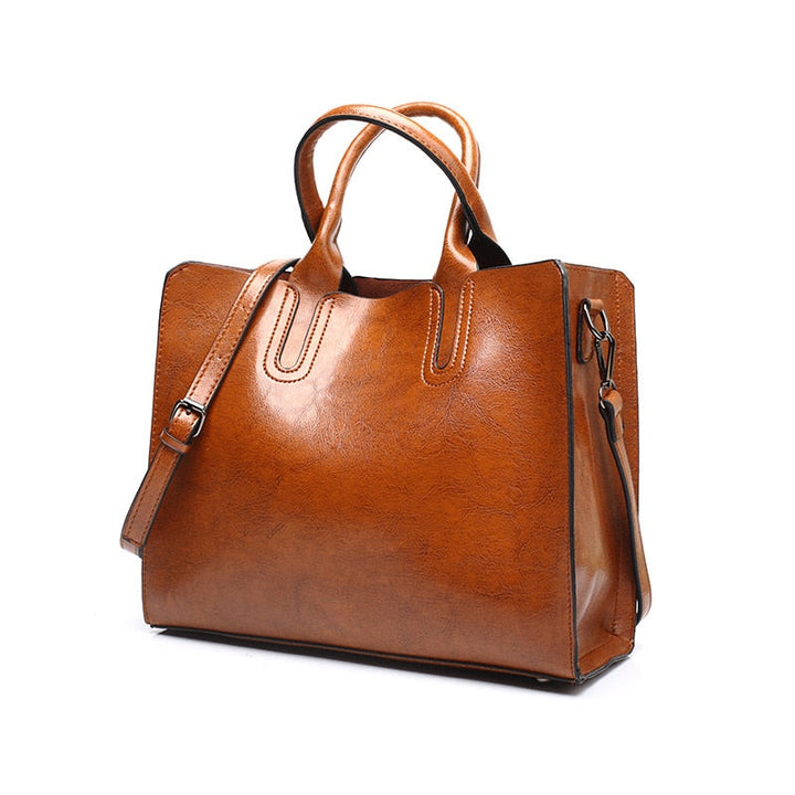 Sac à main femme en cuir marron élégant avec bandoulière, parfait pour le quotidien. Mode et accessoire intemporel.