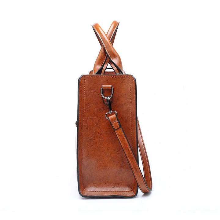 Sac à main marron chic en cuir véritable pour femme. Design moderne avec anse et bandoulière amovible. Accessoire mode.