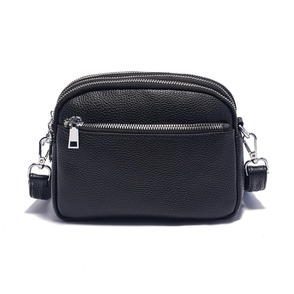 Sac bandoulière en cuir souple pour femme, couleur marron, avec fermeture éclair dorée, tendance et fonctionnel.